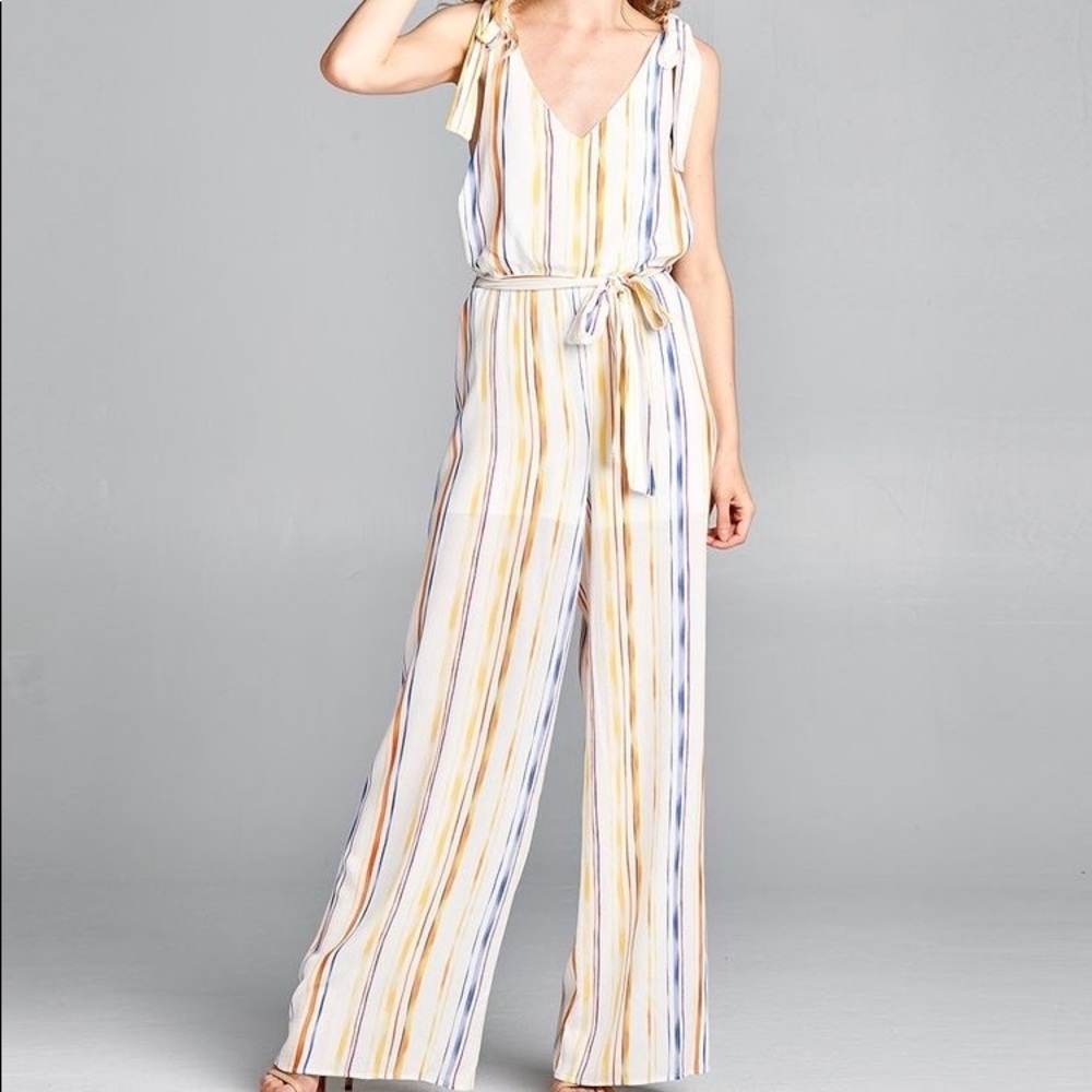 Striped jumpsuit with tie shoulders and tie around waste. Size 10-12. NWT.